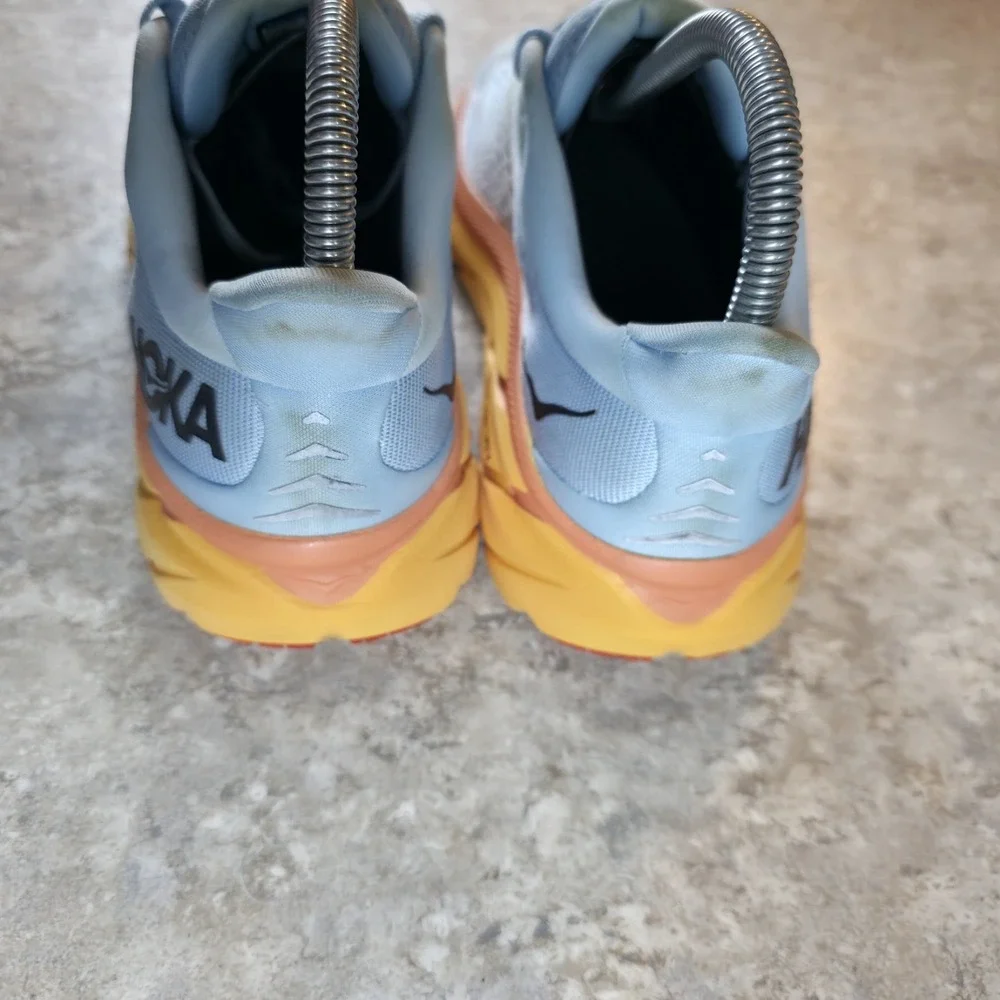 Hoka One One Women's Light Blue Running Shoes with Yellow and Orange Midsole